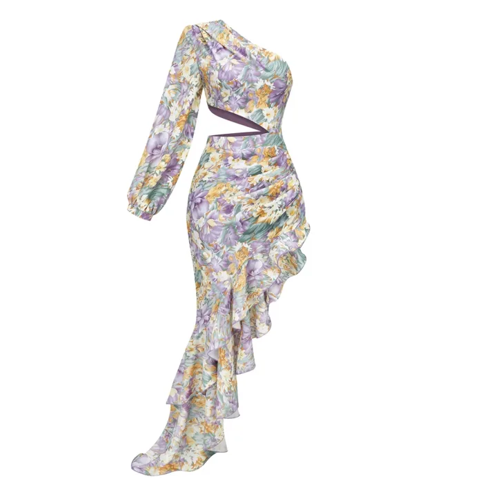 The Hollowed-Out Hip Irregular Ruffled Floral Dress features an asymmetrical design with one long sleeve, a diagonal waist cutout, and a ruffled cascading skirt in a yellow, purple, and green floral print on a light background.