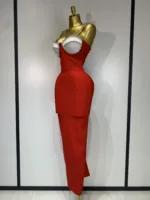 A mannequin showcases the Crystal Bust Long Bodycon Dress, a fitted, sleeveless red ankle-length dress featuring a pearl-embellished white bustier top, designed for an hourglass silhouette against a plain light background.