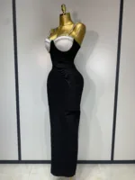 A gold mannequin showcases the Crystal Bust Long Bodycon Dress—a form-fitting, sleeveless black dress featuring a crystal-embellished bustier—set against a plain, light background.