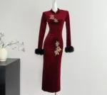 an image of a burgundy long sleeve velvet dress