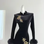 an image of a black long sleeve velvet dress