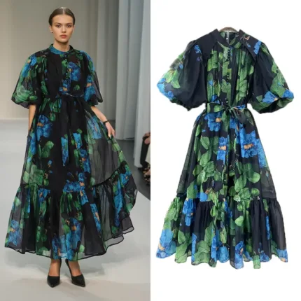Model wearing a green printed puff sleeve elegant dress with a fitted waist and flowing skirt