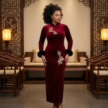 A woman wearing long sleeved embroidered dress featuring intricate floral patterns, fitted waist maxi dress,