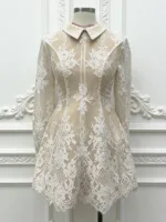 A mannequin of a women’s lace dress with Peter Pan collar, featuring delicate floral lace, vintage-inspired design, and a classic, feminine silhouette