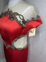 Side view of the red mesh and satin long dress.